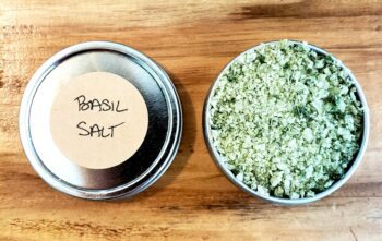 Image of a closed and an open tin of Basil Salt