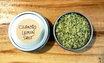 Image of a closed and an open tin of Cilantro Lemon Salt