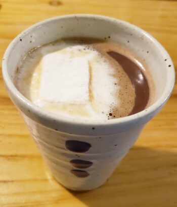 Image of a Homemade Marshmallow melted into a cup of hot cocoa