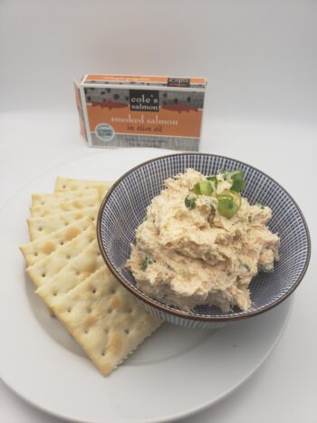 Image of Coles smoked salmon plated as a dip with saltines and chive