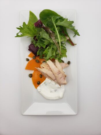 Image of Don Bocarte boniot del norte plated with butternut squash, creme fraiche, and greens