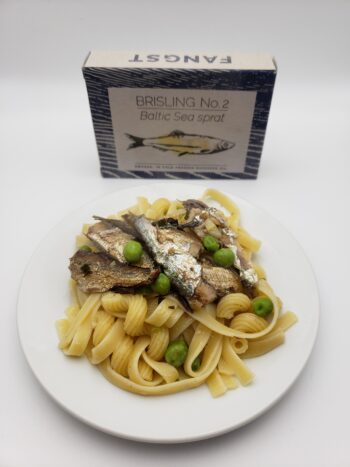 Image of Fangst Brisling 2 plated with pasta and peas