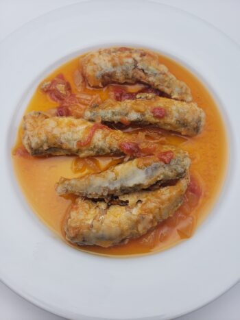 Image of La Brujula fried sardines in sauce #35 on plate