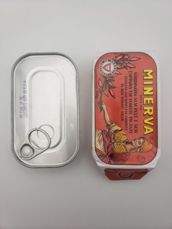 Image of Minerva sardines in hot tomato sauce tin out of wrapper