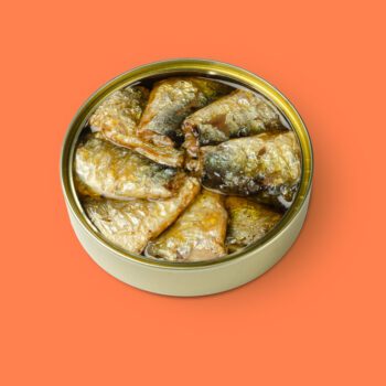 Image of an open tin of Güeyu Mar Chargrilled Sardine Tails