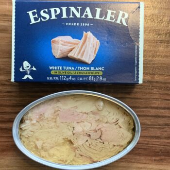 Image of Espinaler White Tuna box above an opened tin.