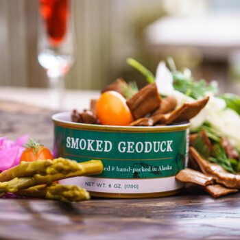 Image of Smoked Geoduck from Wildfish Cannery, open can with suggested serving hints.