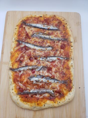 Image of Iasa spicy anchovies on homemade pizza