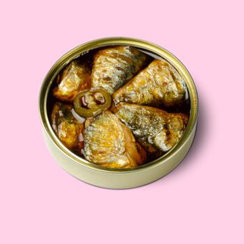 Image of an open tin of Güeyu Mar Chargrilled Sardine Tails in Escabeche (Colas en Escabeche)