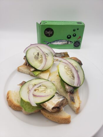 Image of Bogar spiced sardine on toast triangle with cucumbers and red onion