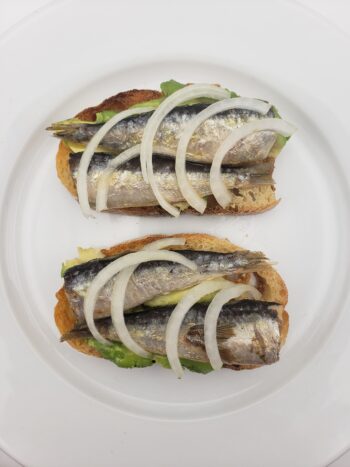 Image of Jose Gourmet small sardines in olive oil on toast with avocado
