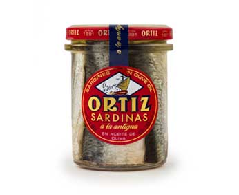 Image of the front of a jar of Ortiz Sardinas a la Antigua "Old Style" Sardines in Extra Virgin Olive Oil, Glass Jar