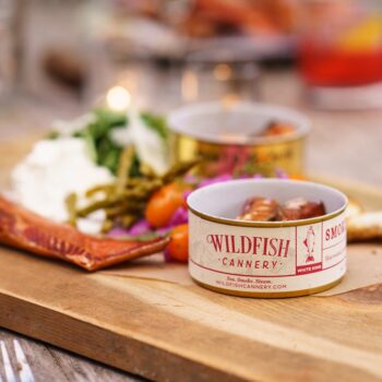 Image of an open tin of Wildfish Cannery Smoked White King Salmon