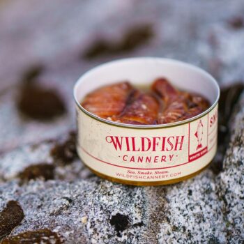 Image of an open tin of Wildfish Cannery Smoked White King Salmon