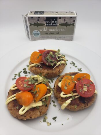 Image of Coles wild mackerel as patties with tomatoes and mayo