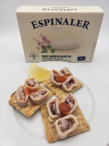 Image of Espinaler Squid in olive oil 6/8 on crackers with Espinaler hot sauce