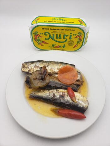 Image of Nuri spiced sardines on plate with pickles