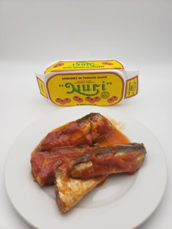 IMage of Nuri sardines in tomato sauce on plate