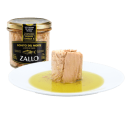 Image of a jar and the contents turned out onto a plate of Zallo Bonito del Norte (White Tuna), glass jar