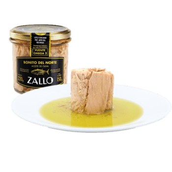 Image of a jar and the contents turned out onto a plate of Zallo Bonito del Norte (White Tuna), glass jar