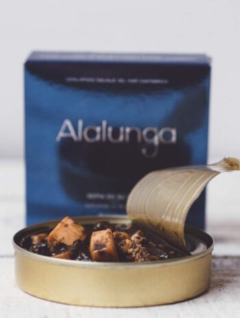 Image of the front of a package and an open tin of Artesanos Alalunga Cuttlefish In Its Own Ink