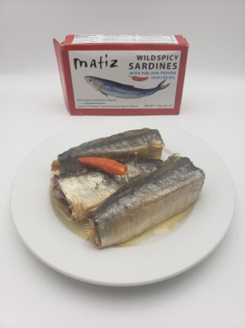 Image of Matiz Wild Spicy Sardines with Piri Piri pepper contents on a plate