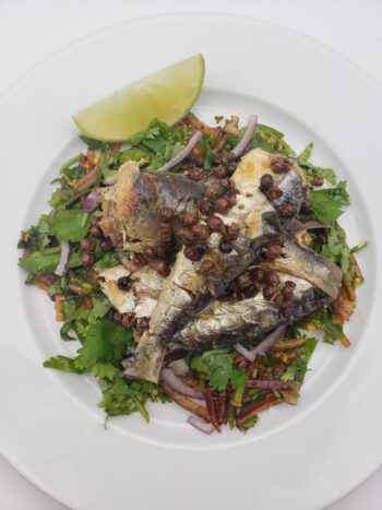 Image of les mouettes d'arvour sardines with sichuan peppercorns on thai salad