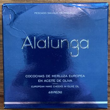 Image of the front of a package of Artesanos Alalunga Cocochas de Merluza Europea (European Hake Cheeks) in Olive Oil 6/8