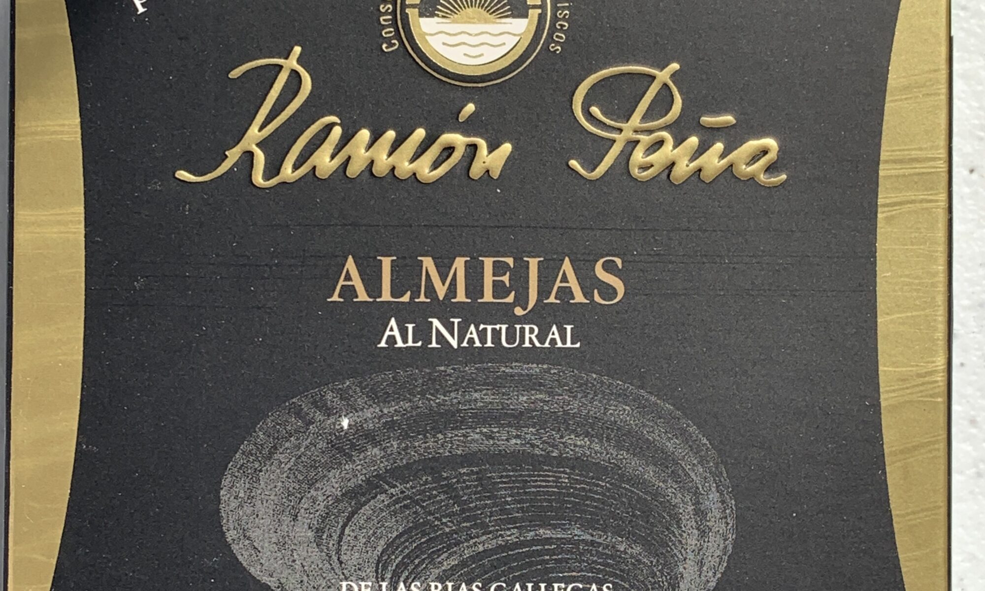 Image of the front of a package of Ramón Peña Clams in Brine 18/20