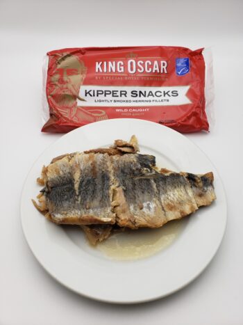 Image of King Oscar Kipper Snacks plated tin contents