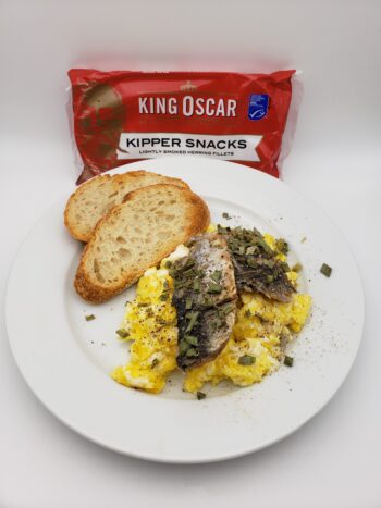 Image of King Oscar Kipper Snacks plated with scrambled eggs and toast
