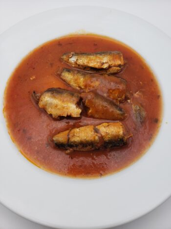 Image of Pollastrini sardines with tomato on plate