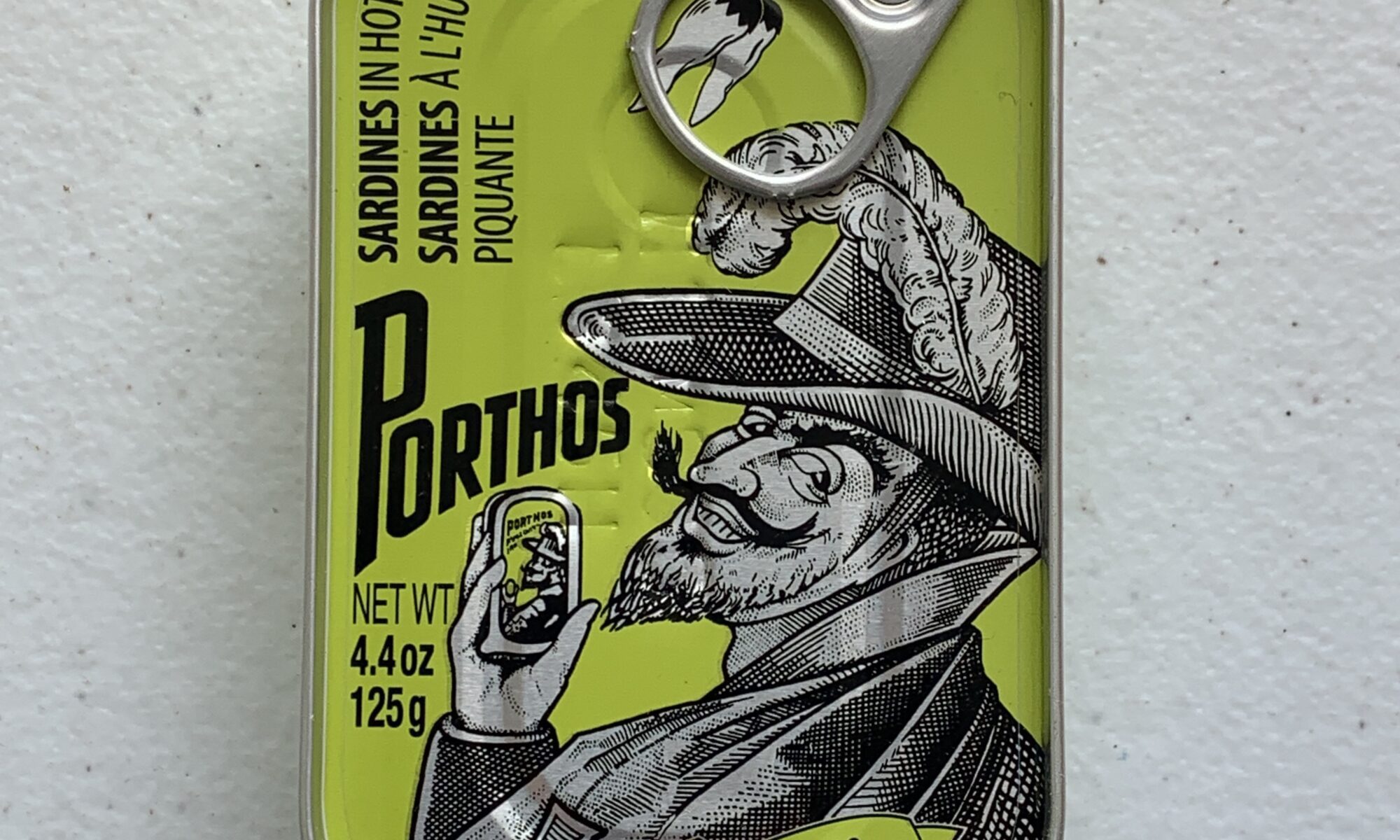 Image of the front of a tin of Porthos Sardines in Hot Vegetable Oil 3/5