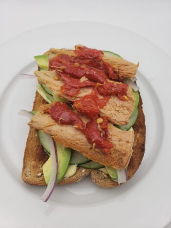 Image of Coles tuna with red peppers on toast with avocado, cucumber, red onion, and mayo