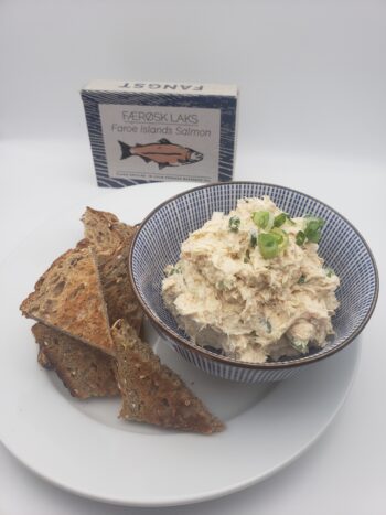 Image of Fangst Faroe Islands Salmon plated as a dip with wheat triangles and chives