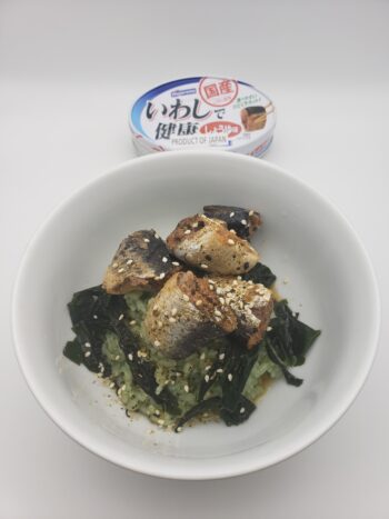 Image of Hagoromo sardines in soy plated with bamboo rice, wakame, and sesame
