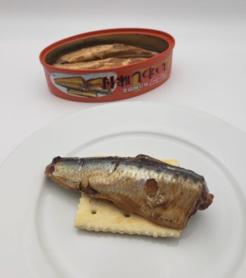 Image of Nissui Sardines in Sweet Soy plated on a saltine
