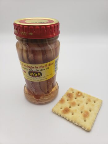 Image of Iasa anchovies in jar with saltine cracker
