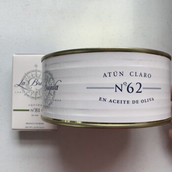 Image of a tin of La Brújula Yellowfin Tuna in Olive Oil, No. 62 Large Format and a regular tin for comparison.
