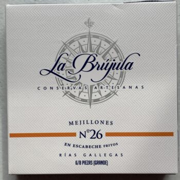 Image of the front of a package of La Brújula Mussels in Pickled Sauce (Mejillones in Escabeche) 6/8 No. 26