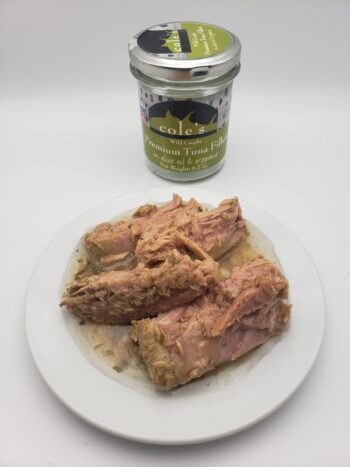 Image of Coles tuna fillets in olive oil with oregano contents on plate