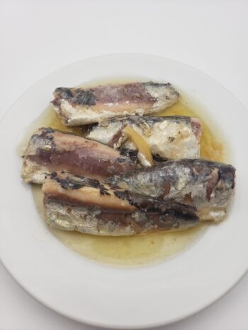 Image of Minerva sardines with olive oil and lemon on plate