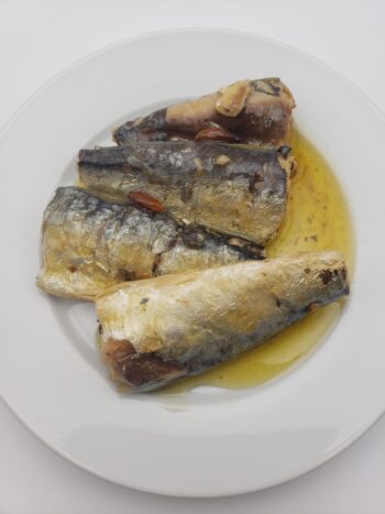 Image of Minerva sardines with piri piri and olive oil on plate