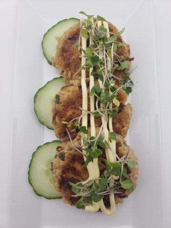 Image of MInerva mackerel in olive oil as cakes with cucumbers