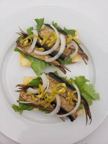 Image of Riga Gold smoked sprats 160 on toast with avocado and onion