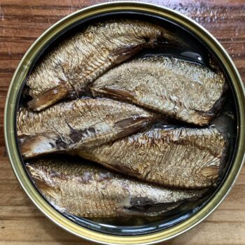 Image of an opened tin of Riga Gold Smoked Sprats in Oil 16/20, 240G