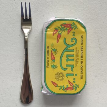 Image of a Cocktail Fork, Acopa Vernon, Stainless Steel, Heavy Weight, next to a tin of sardines for scale.