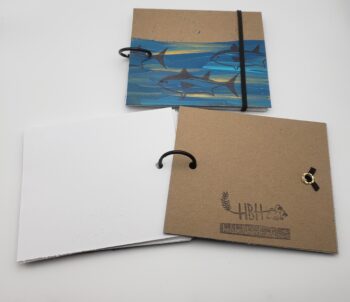 Image of handmade tuna book with elastic closure open