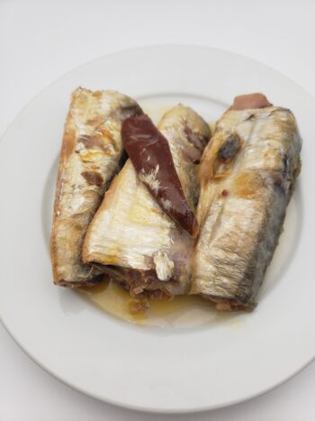 Image of bon appetit sardines in hot olive oil on plate