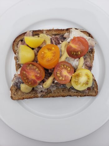 Image of bon appetit sardines in olive oil on wheat toast with tomatoes